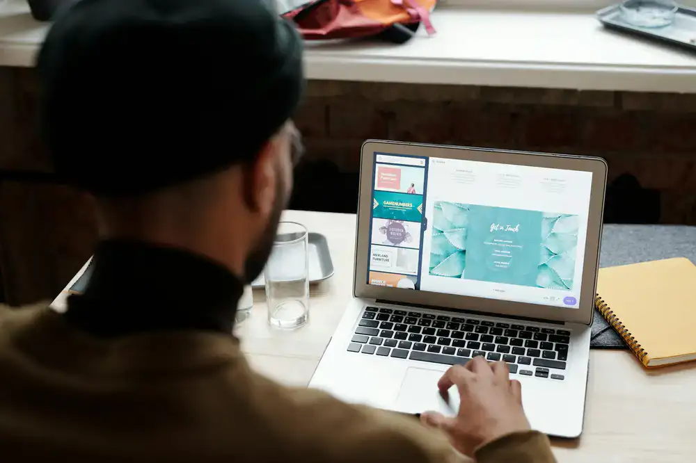 Design student working on an interface design project at a desk